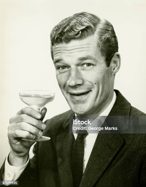 Young Businessman Holding Wine Glass Portrait Stock Photo - Download Image Now