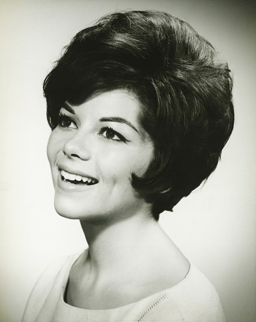 Image taken in 1980: Smiling young woman looking at the camera