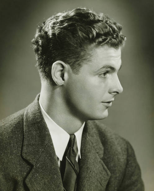 Young man posing in studio, (B&W), close-up, portrait  slicked back hair stock pictures, royalty-free photos & images