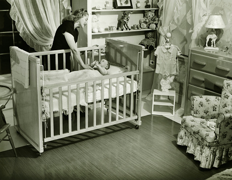 Details on the children's bed with a safety fence made of ash wood
