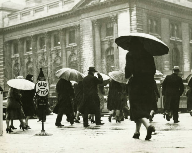 Pedestrians walking in rain in New York City, (B&W) old town photos stock pictures, royalty-free photos & images