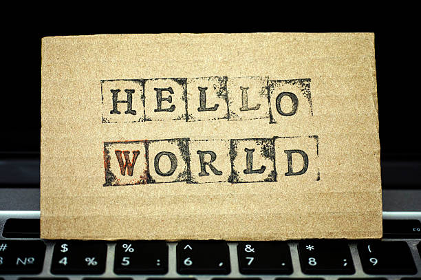 Cardboard with words Hello World on laptop keyboard