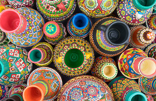 istock Composition of artistic painted handcrafted pottery jars 576545366
