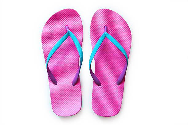 istock Pink flip flops isolated on white background 576548948