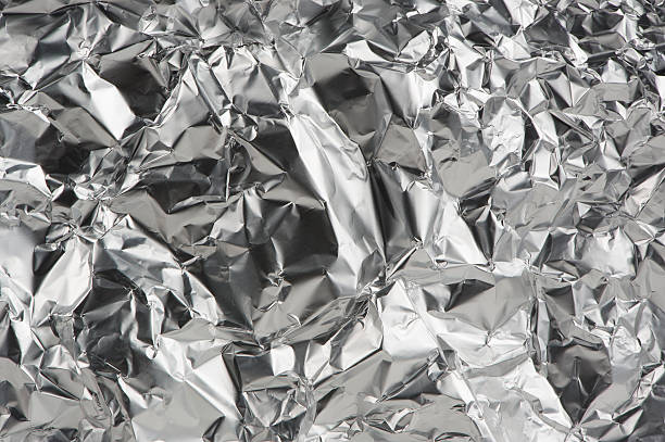 istock Crumpled Aluminum Foil as Background 576550896