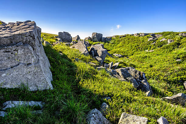 istock huge stones in valley on top of mountain range 576551680