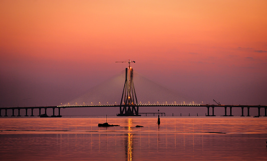 The Bandra-Worli Sea Link, also called Rajiv Gandhi Sea Link at dusk. It is a cable-stayed vehicular bridge that links Bandra in the northern suburb of Mumbai with Worli in South Mumbai. Copy space