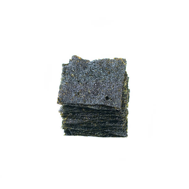 istock fried seaweed isolated on white background. 576554250