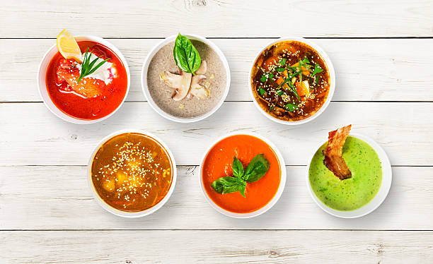 istock Variety of soups at white wood, top view 576554340