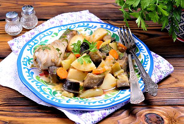 istock Chicken stew with vegetables, potatoes, eggplant, zucchini, onions, carrots 576554720