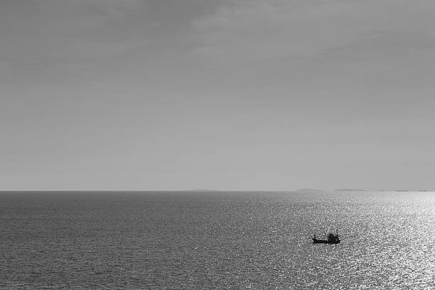 istock Fishing boat alone in the ocean 576556200
