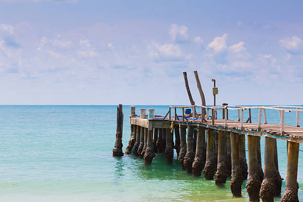 istock Fishing jetty over seacoast skyline 576556298