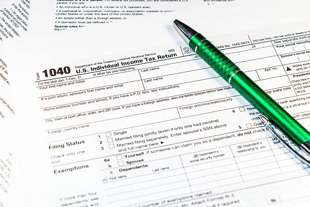 istock Pen on tax form 1040 576556442