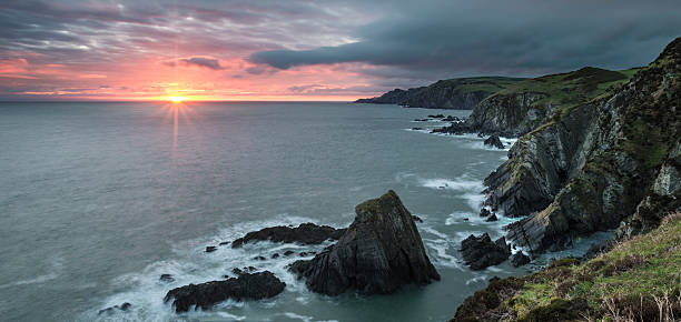 istock Sunrise over Bull Point landscape in Devon England 576556620