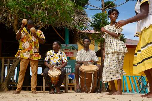 Hopkins Village, Belize - July 03, 2016: Garifuna troupe performs traditional songs with drumming and dancing in Hopkins Village.