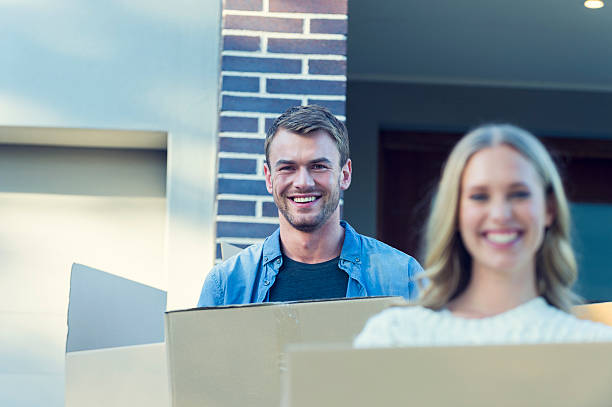 istock Man and woman moving house. 576558412