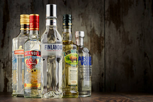 composizione con bottiglie di vodka - smirnoff vodka bottle alcohol foto e immagini stock