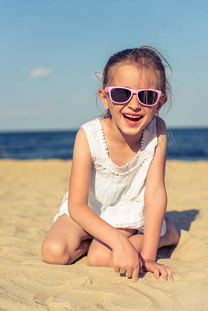 istock Little girl on the beach 576563926