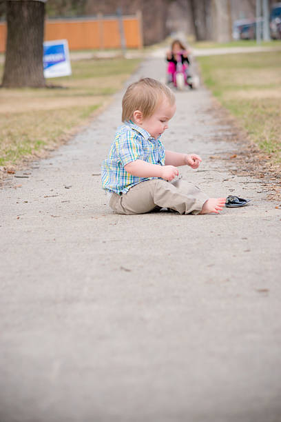 istock Putting on shoes by himself 576564420