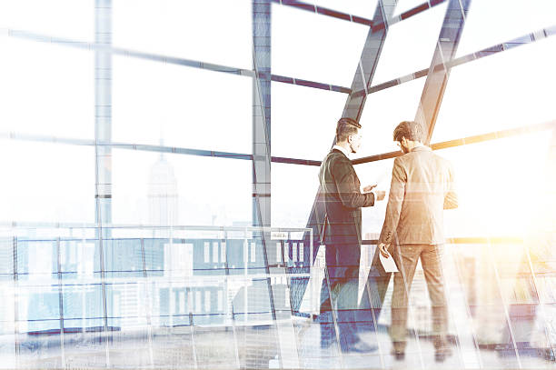istock Businesspeople discussing contract multiexposure 576565194
