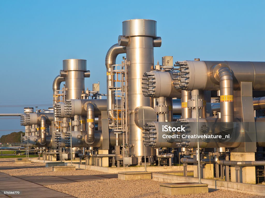 natural gas processing site natural gas processing site during sunset Built Structure Stock Photo