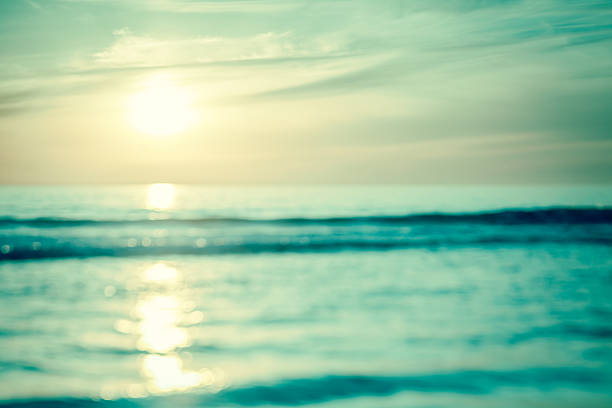 istock Abstract overexposed toned image of sunset over ocean 576570916