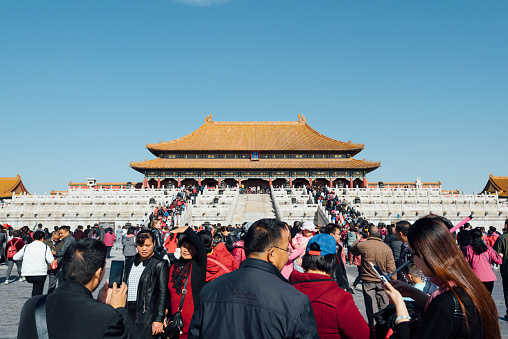 Beijing, China - October 27, 2015: Large crowed of tourists near The Hall of Supreme Harmony in the Forbidden City in Beijing China. Hall of Supreme Harmony is the largest hall within the Forbidden City.