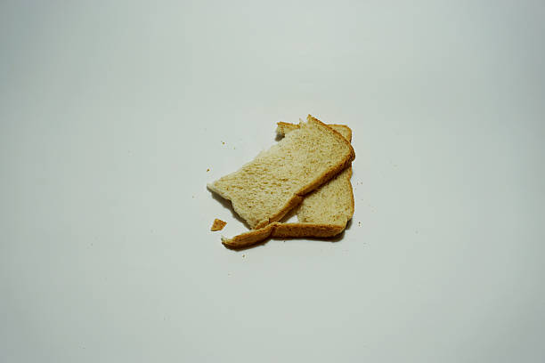 istock pieces of wheat  bread isolated on white background 576573564