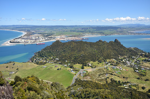 Heads of Whangarei harbour from Mt Manaia showing oil refinery at Marsden Point.
