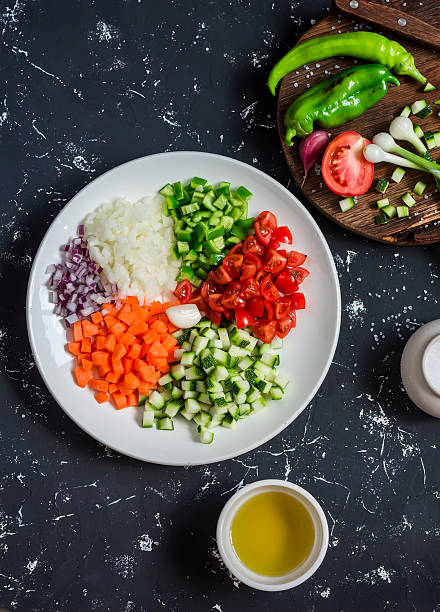 istock Fresh chopped vegetables - tomatoes, zucchini, carrots, tomatoes, onions, peppers 576575784