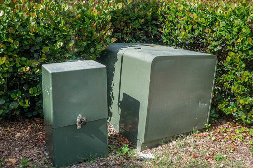Green outdoor housing for electrical boxes or air-conditioner units or other items that need protection from the rain, snow, and wind.