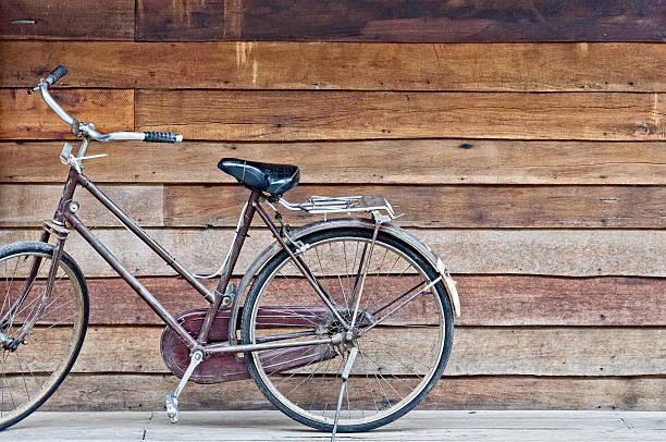 istock old classic style bicycle park on old rough texture wood 576576158