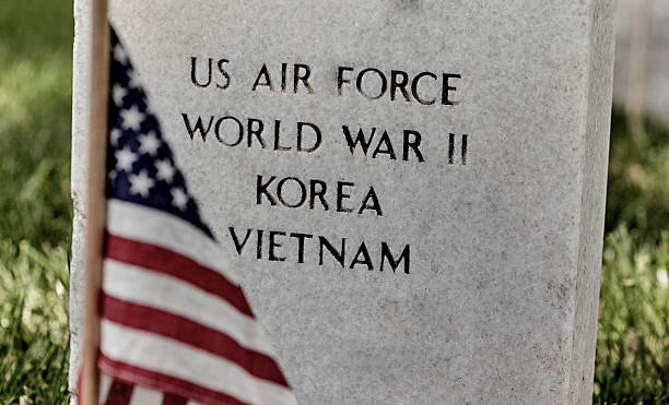 istock American Flag on a Soldiers Gravesite 576577040
