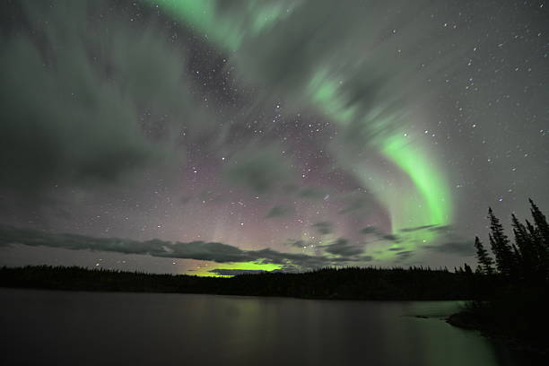 istock Aurora Borealis and stars at night 576577070