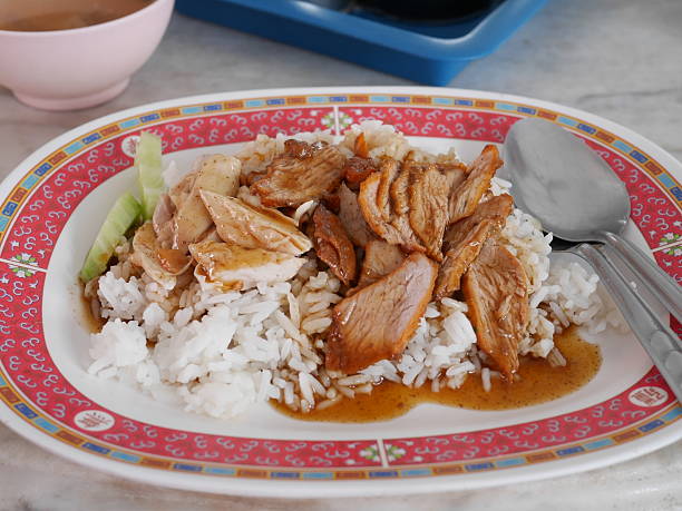 istock Hainanese chicken pork rice with sauce 576577074