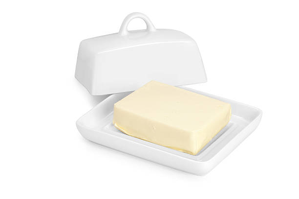 istock butter in white ceramic butter-dish on white background 576577196