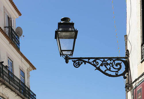 Ornate old European ironwork street lamp