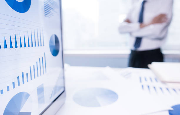 istock businessman by office window 576577770