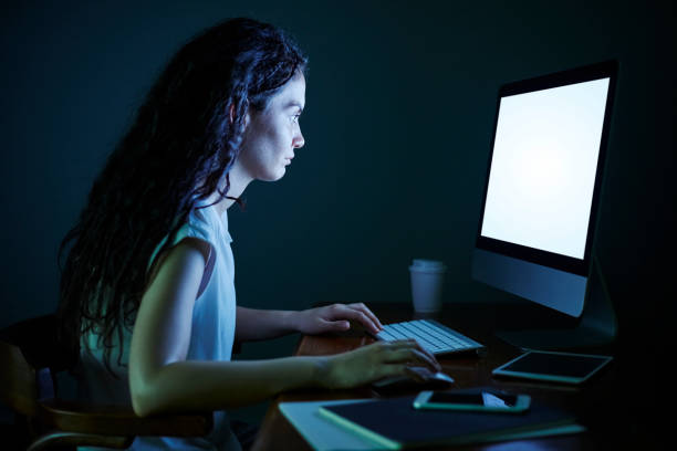 istock Businesswoman Working Late 576578940