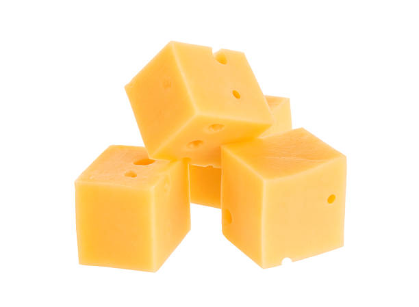 istock Cubes of cheese isolated on white 576581294