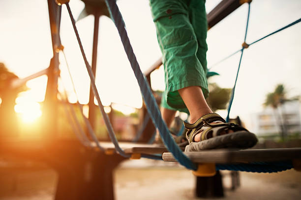 istock Child walking at the playground on summer day evening 576581836