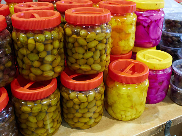 Glass jars with pickled olives stock photo