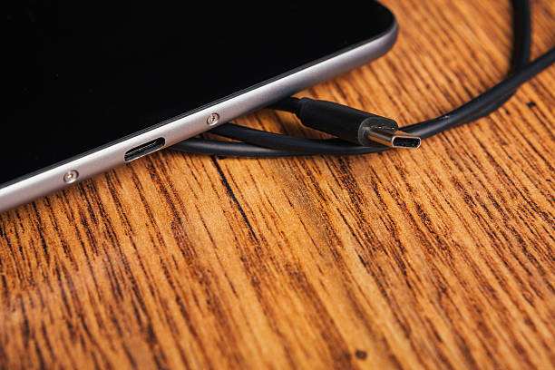 istock new tablet with built-in usb-c on wooden background 576584408