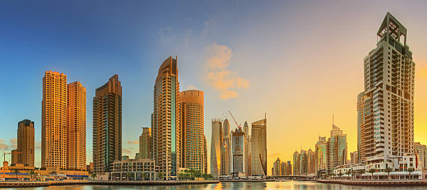 istock Dubai Marina bay with yacht and cloudy sky, UAE 576591656