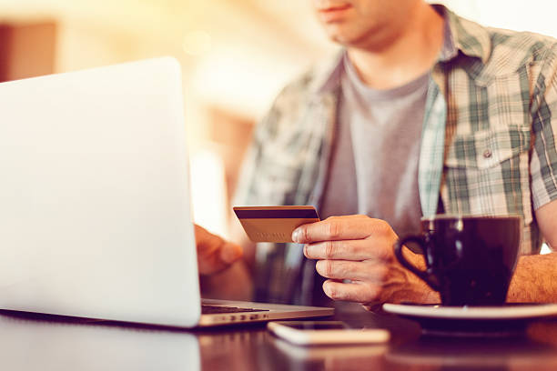 istock Man making credit card payments online 576593080