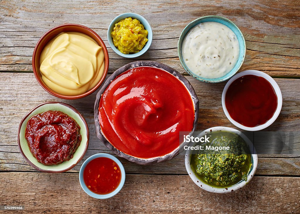 various dip sauces bowls of various dip sauces, top view Condiment Stock Photo