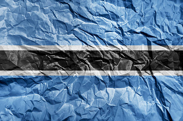 Botswana flag painted on crumpled paper background