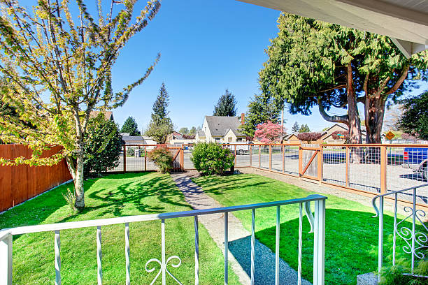 istock View of small front yard with narrow concrete walkway 576596480