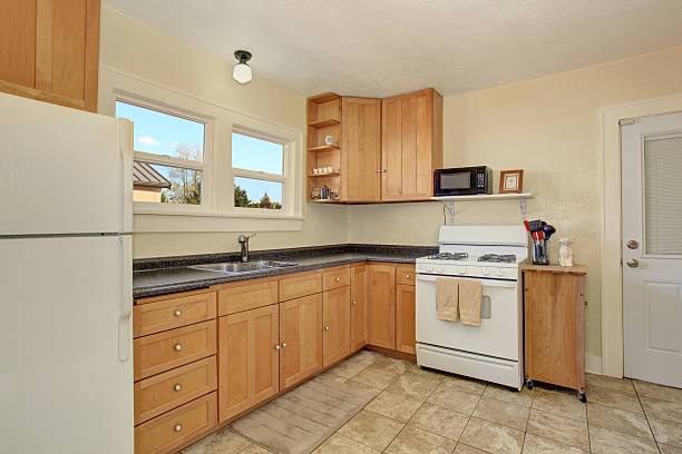 istock Bright kitchen room interior with honey color cabinets 576596888