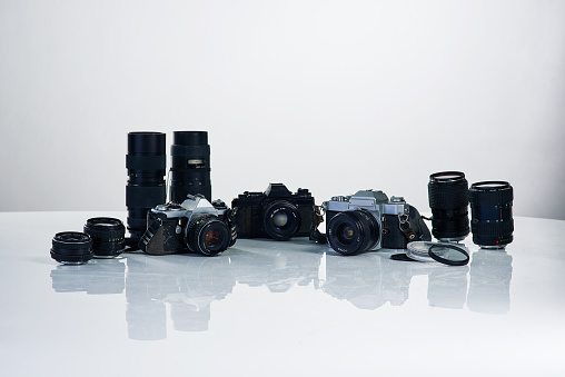 Studio shot of various cameras and their accessories